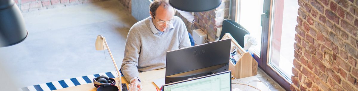 gentleman working on a desktop computer