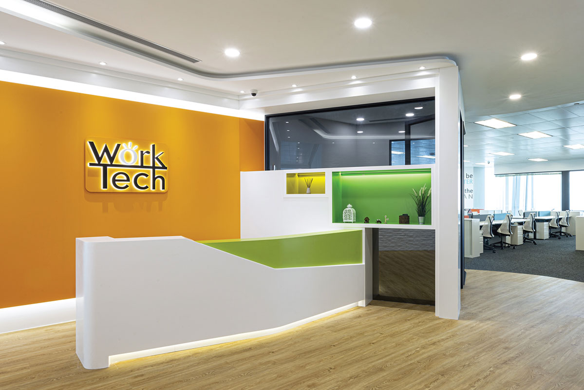 A vibrant and modern reception desk at WorkTech
