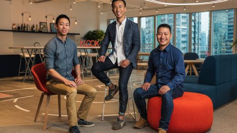 Klook Founders Sitting and Posing for a Photo In Their Hong Kong Office