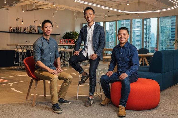 Klook Founders Sitting and Posing for a Photo In Their Hong Kong Office